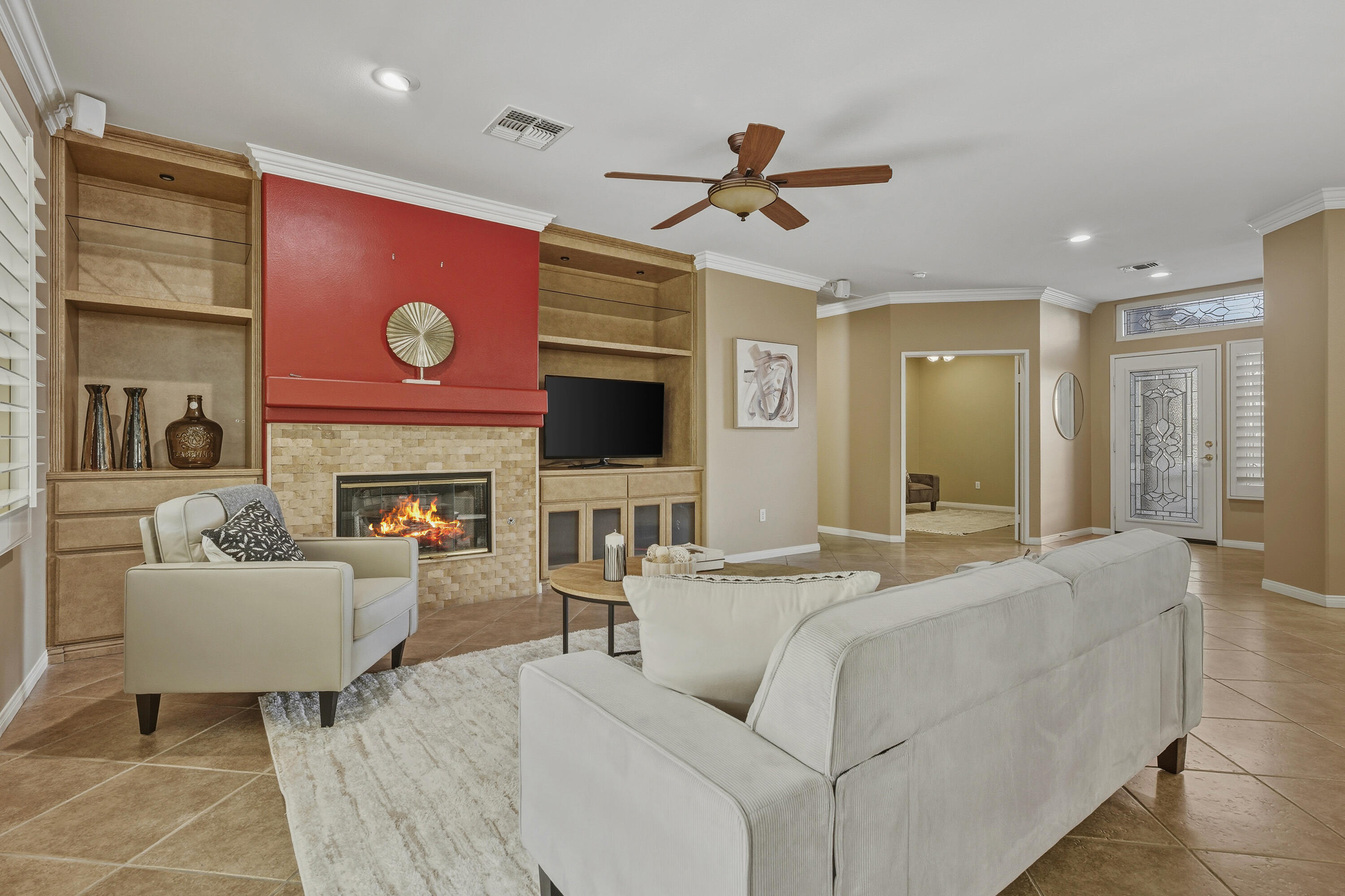 78589 Rainswept Way Palm Desert, CA 92211 - Photo 9 of 30 a living room with furniture and a fireplace