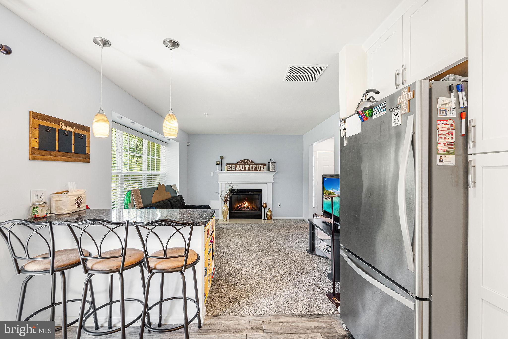 803 Tanglewood Drive Sicklerville, NJ 08081 - Photo 12 of 26 a living room with furniture and a fireplace