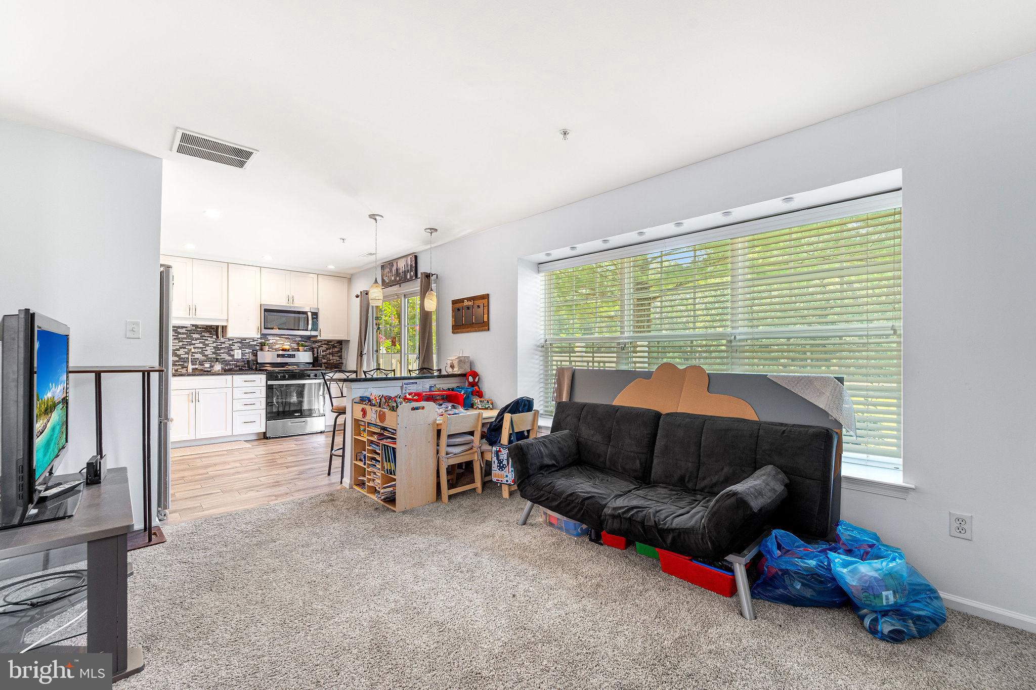 803 Tanglewood Drive Sicklerville, NJ 08081 - Photo 10 of 26 a living room with furniture and a flat screen tv