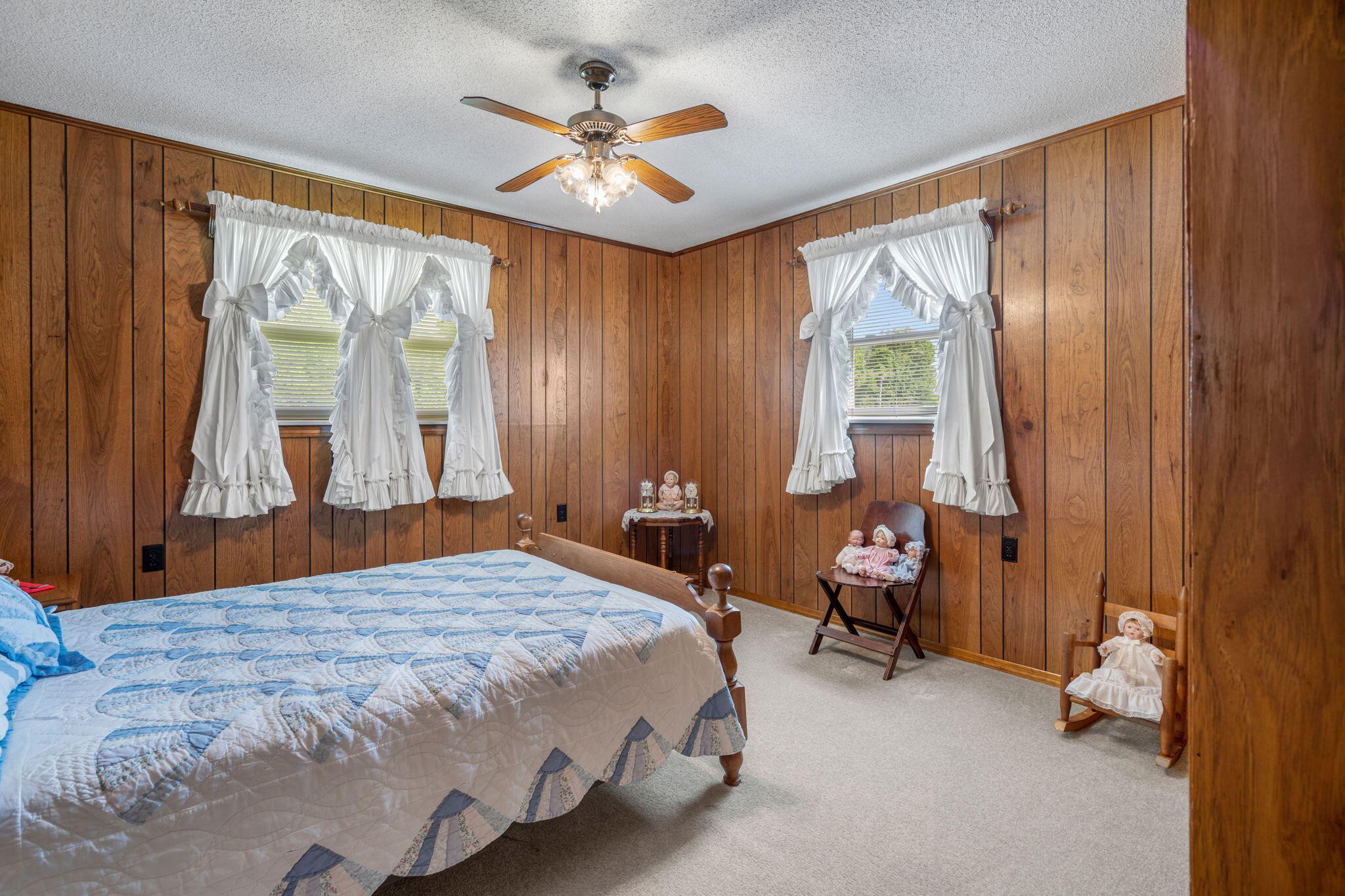 415 Parksville Road Benton, TN 37307 - Photo 13 of 34 a bedroom with a bed and a chandelier