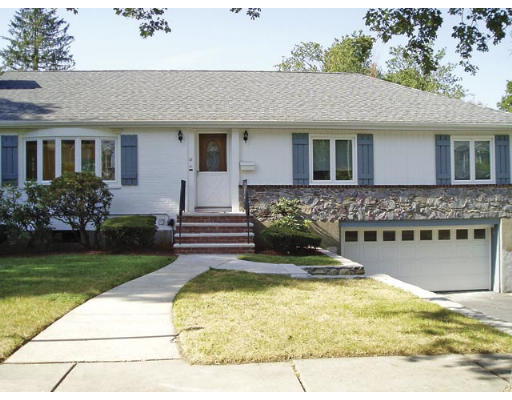 33 Stanley Road Newton, MA 02468 - Photo 1 of 6 a front view of a house with a garden and swimming pool