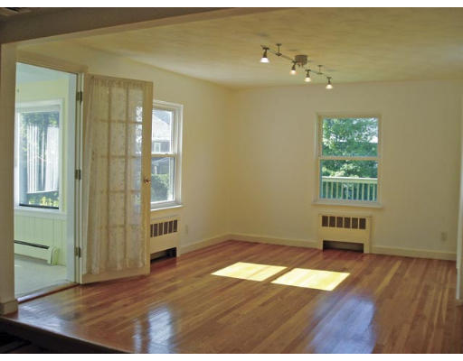 33 Stanley Road Newton, MA 02468 - Photo 2 of 6 wooden floor in an empty room with a window