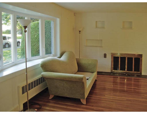 33 Stanley Road Newton, MA 02468 - Photo 3 of 6 a living room with furniture and a floor to ceiling window