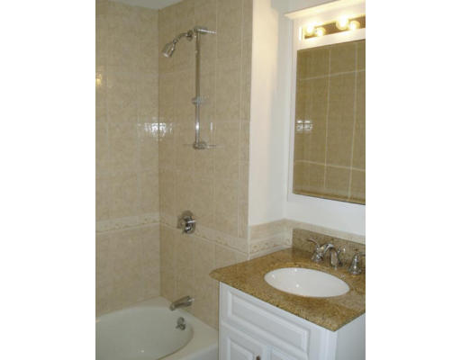 33 Stanley Road Newton, MA 02468 - Photo 4 of 6 a bathroom with a granite countertop sink a toilet and shower