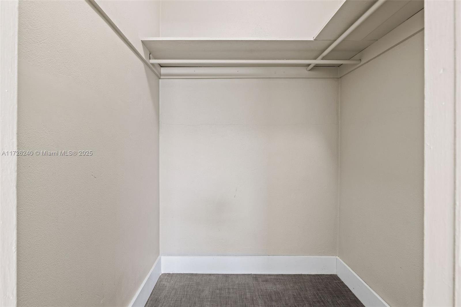 7745 Harding Avenue, Unit 22 Miami Beach, FL 33141 - Photo 8 of 9 a view of walk in closet with clothes