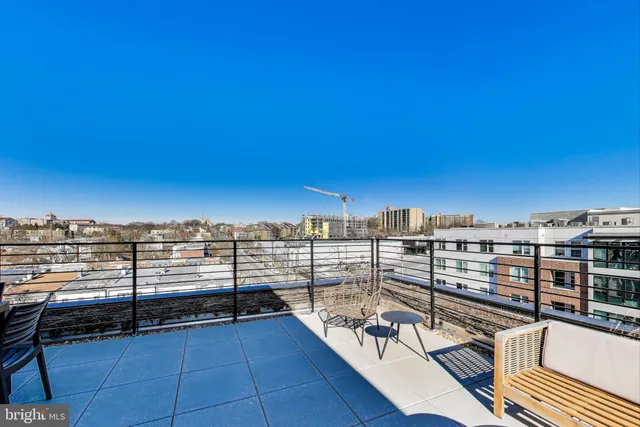 a view of a balcony with wooden floor with city view