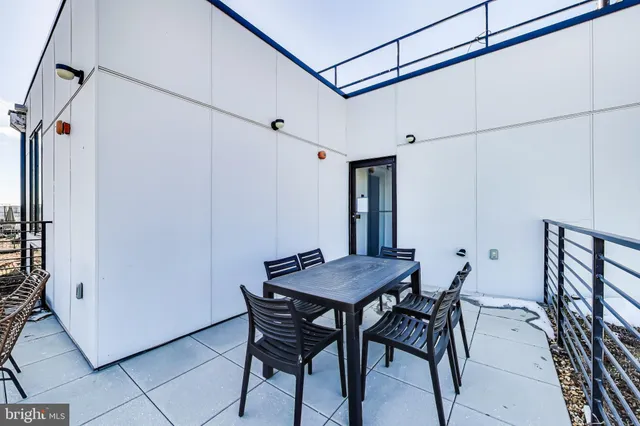 a view of a dining room and livingroom with furniture