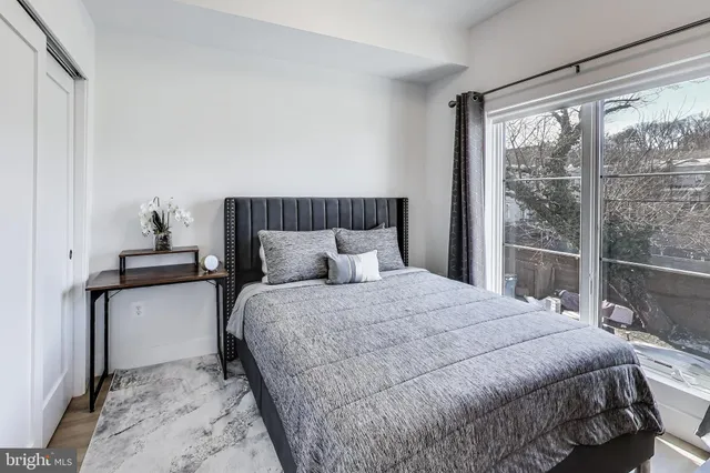 a bedroom with a bed and window