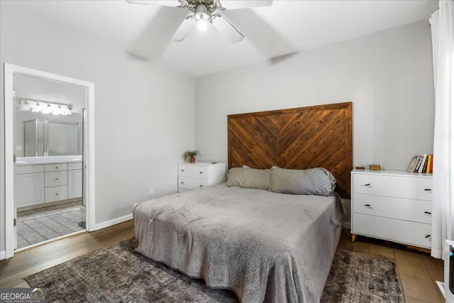 a bathroom with a sink double vanity granite tub and a mirror