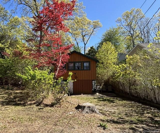 40 Hawthorne Road Rocky Point, NY 11778 - Photo 2 of 19 a front view of a house with a yard