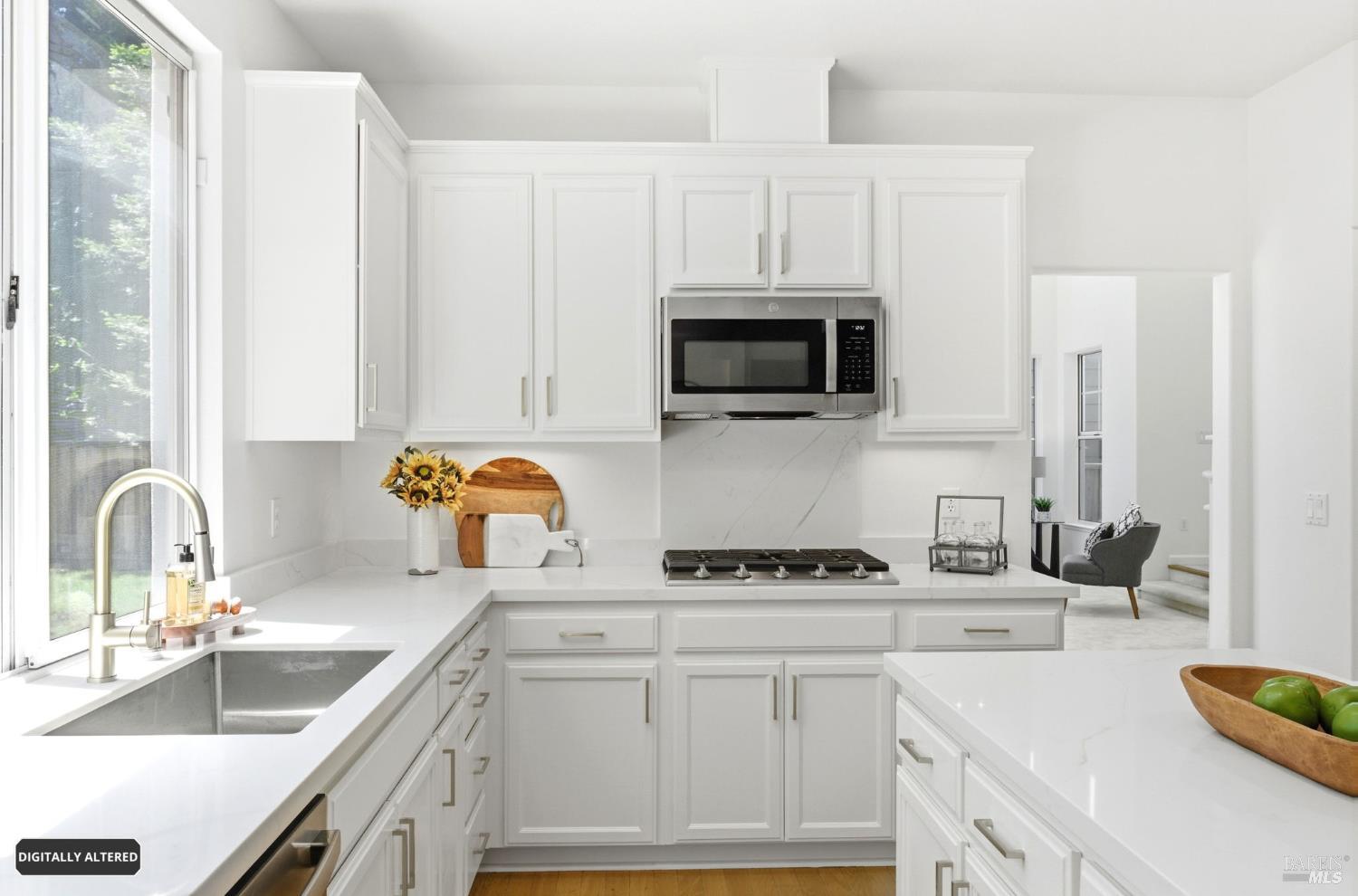 5148 Renaissance Court Fairfield, CA 94534 - Photo 15 of 79 a kitchen with stainless steel appliances a sink a stove a microwave a refrigerator and cabinets