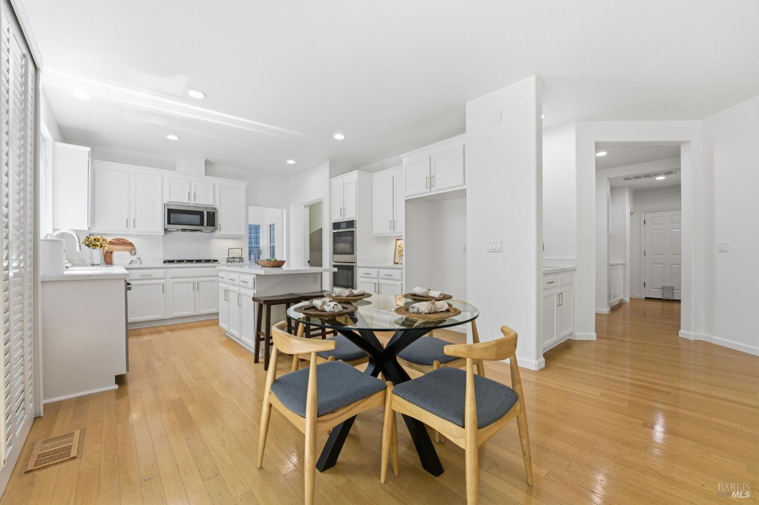 5148 Renaissance Court Fairfield, CA 94534 - Photo 20 of 79 a kitchen with a table and chairs in it
