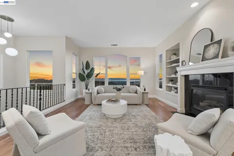 a living room with furniture or couch and a fireplace