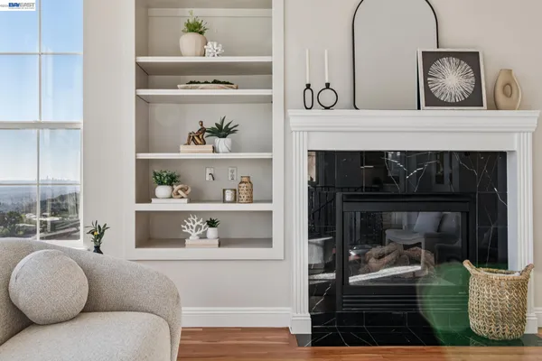 a bedroom with a large bed and a potted plant