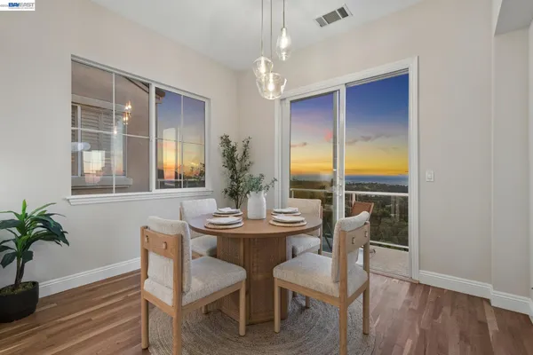 a view of a balcony with chair and glass door