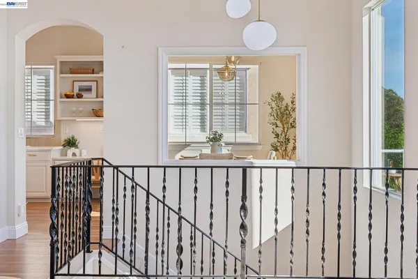 a bathroom with a double vanity sink toilet and a mirror