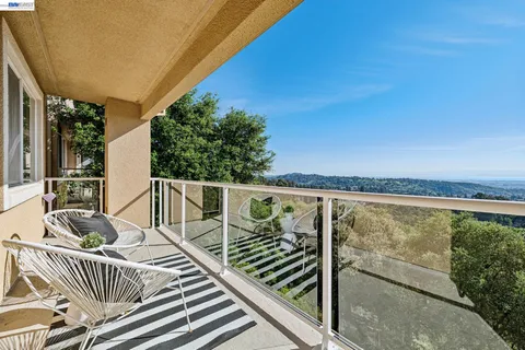 a view of balcony with furniture