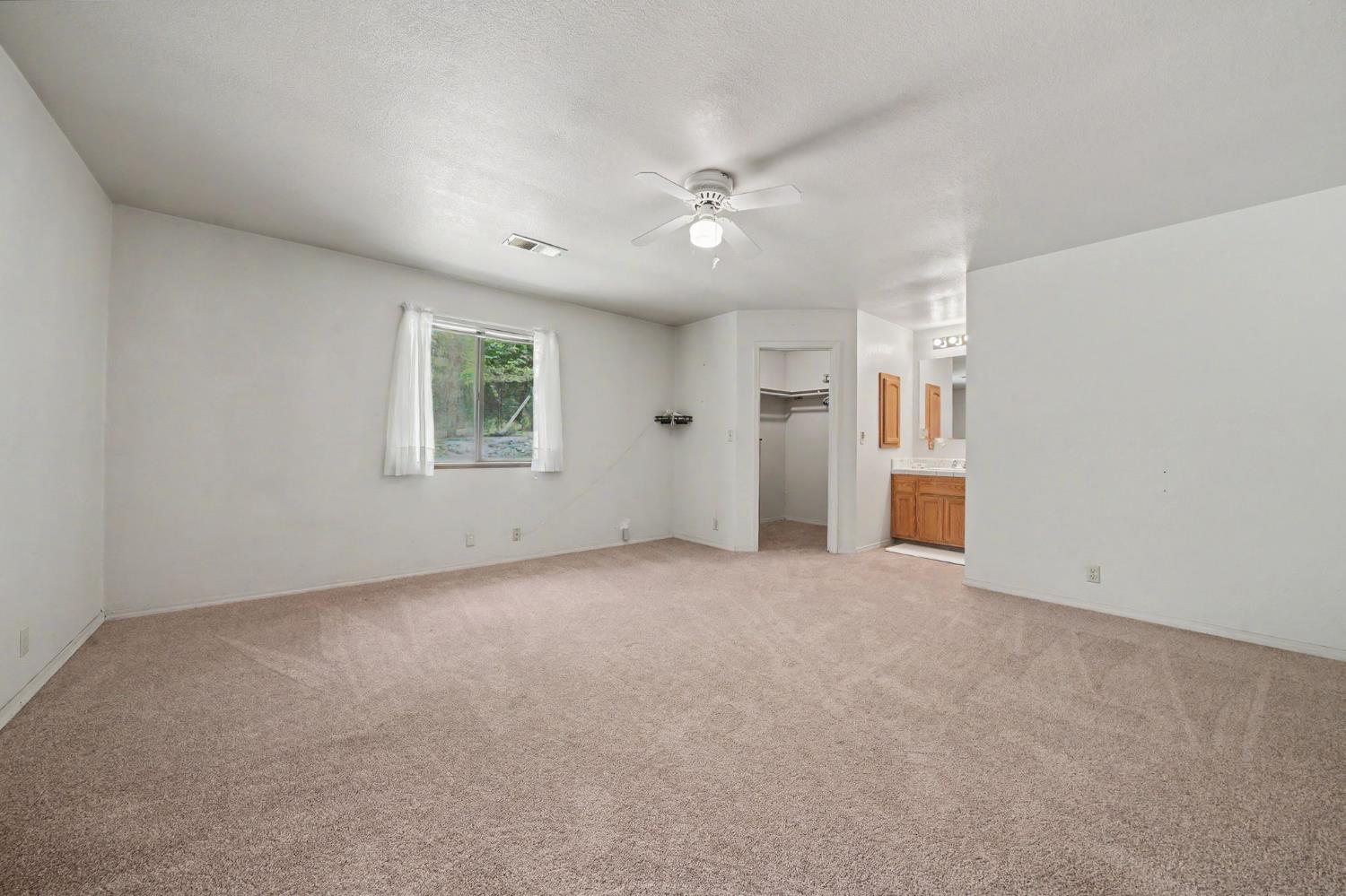 20310 State Rte 26 West Point, CA 95255 - Photo 21 of 57 an empty room with windows and closet