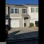 a view of a house with a door and a window