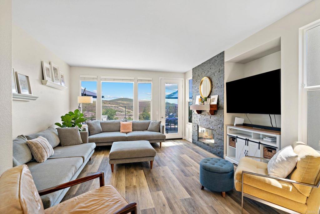 1673 Archer Road San Marcos, CA 92078 - Photo 12 of 47 a living room with furniture and a flat screen tv