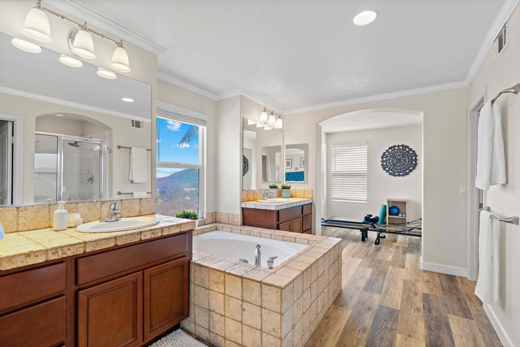1673 Archer Road San Marcos, CA 92078 - Photo 20 of 47 a spacious bathroom with a granite countertop tub sink and mirror