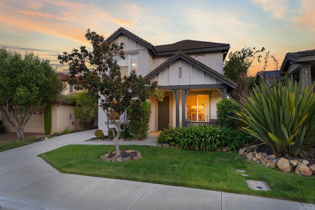 1673 Archer Road San Marcos, CA 92078 - Photo 2 of 47 a front view of a house with a garden