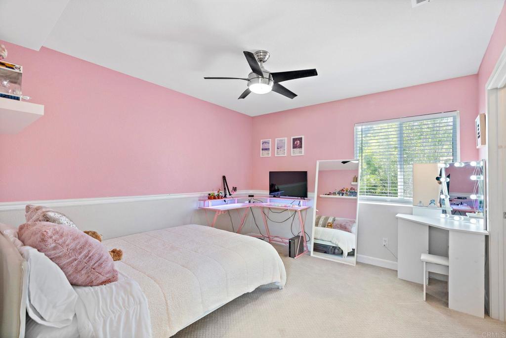 1673 Archer Road San Marcos, CA 92078 - Photo 25 of 47 a bedroom with a bed a desk and chair