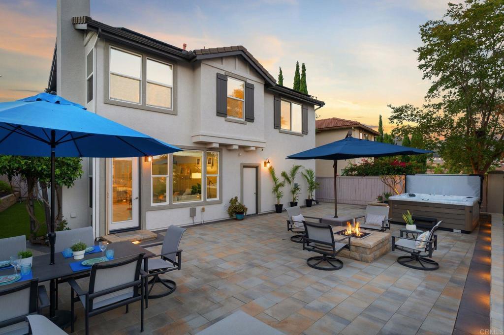 1673 Archer Road San Marcos, CA 92078 - Photo 29 of 47 a view of a patio with a table and chairs under an umbrella