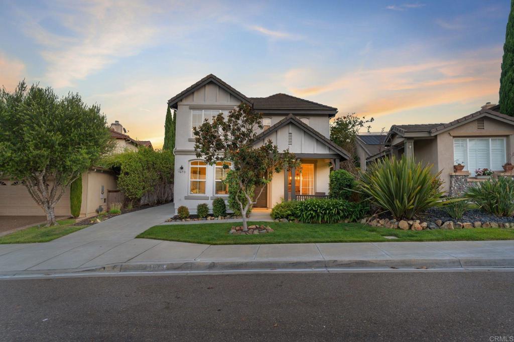 1673 Archer Road San Marcos, CA 92078 - Photo 3 of 47 a front view of a house with a yard and garage