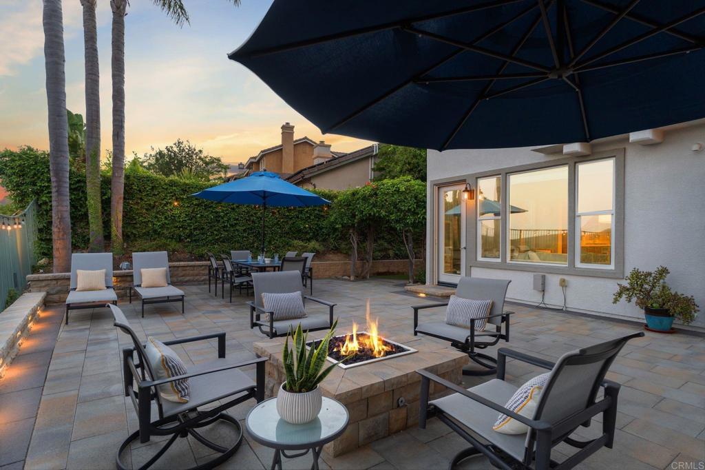 1673 Archer Road San Marcos, CA 92078 - Photo 35 of 47 a patio with patio a table and chairs under an umbrella
