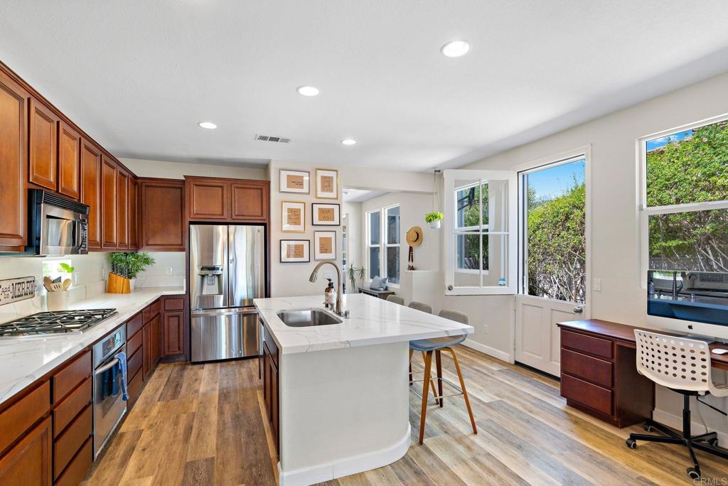 1673 Archer Road San Marcos, CA 92078 - Photo 7 of 47 a very nice looking kitchen with a large window and stainless steel appliances