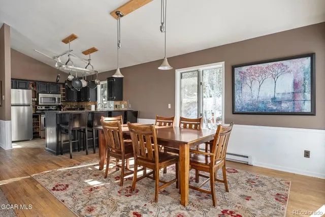 a view of a dining room with furniture window and wooden floor