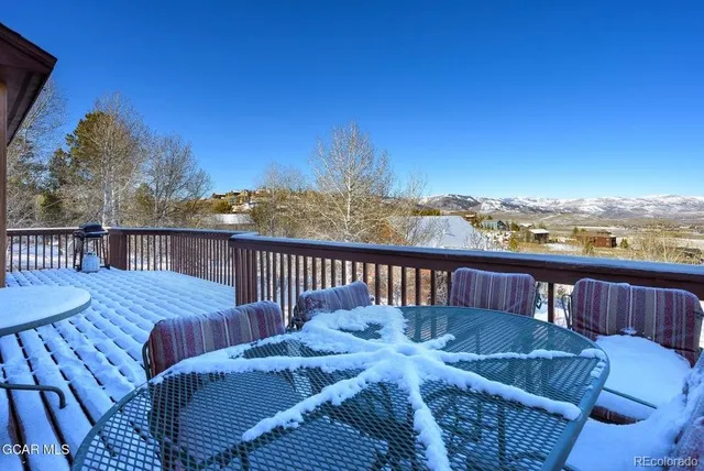 a view of a balcony with furniture
