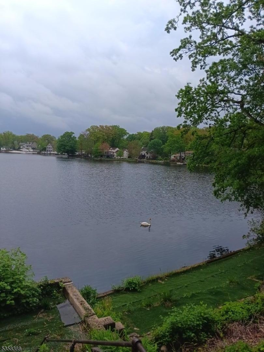 69 Fox Hill Road Denville, NJ 07834 - Photo 1 of 6 a view of a lake with a city