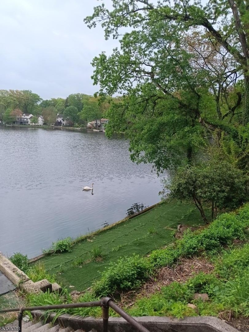 69 Fox Hill Road Denville, NJ 07834 - Photo 2 of 6 a view of a lake and green valley