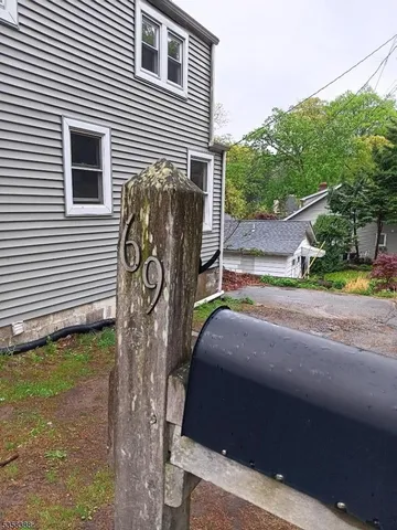 a view of a house with a street