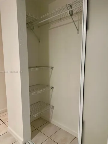 a bathroom with a toilet a sink and a mirror