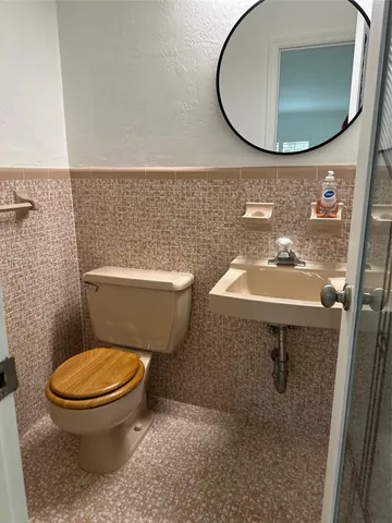 a view of a livingroom with furniture and cabinet