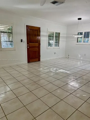 a view of a kitchen with windows