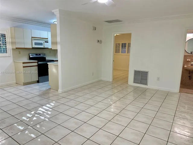 a kitchen with stainless steel appliances a stove a sink and a refrigerator