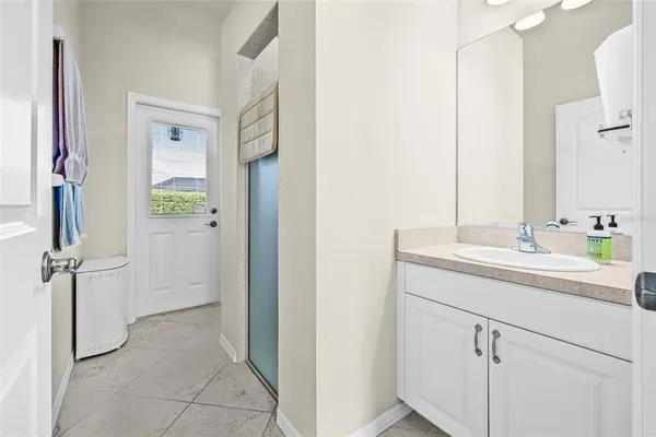 a bathroom with a sink and a mirror