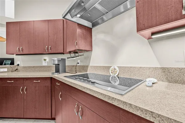 a kitchen with a sink and cabinets
