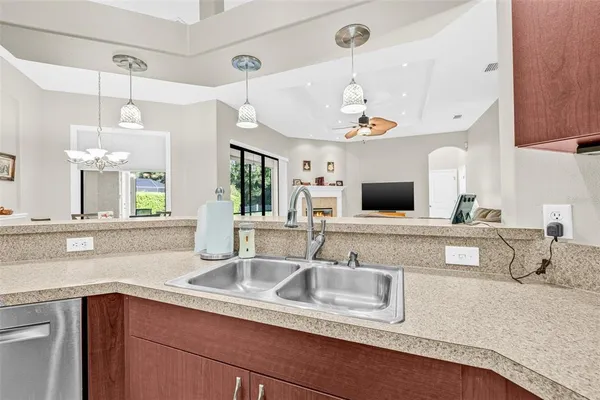 a kitchen with a sink and a refrigerator