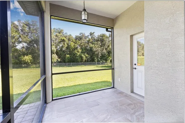 a view of a back yard from a balcony
