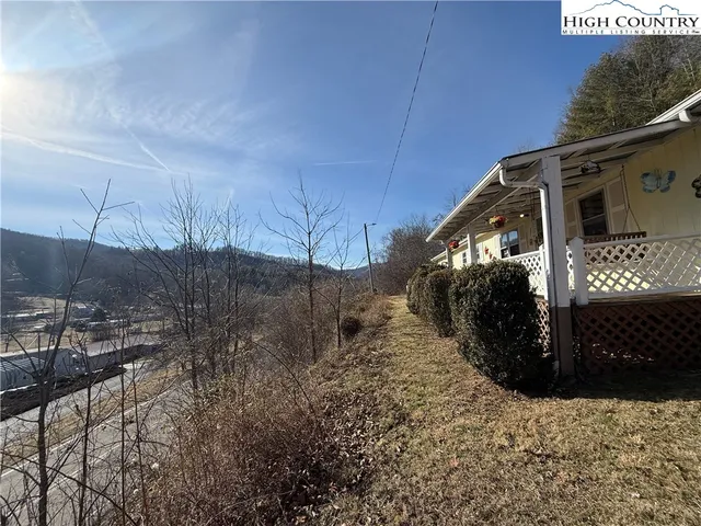 a view of a house with a snow in the yard