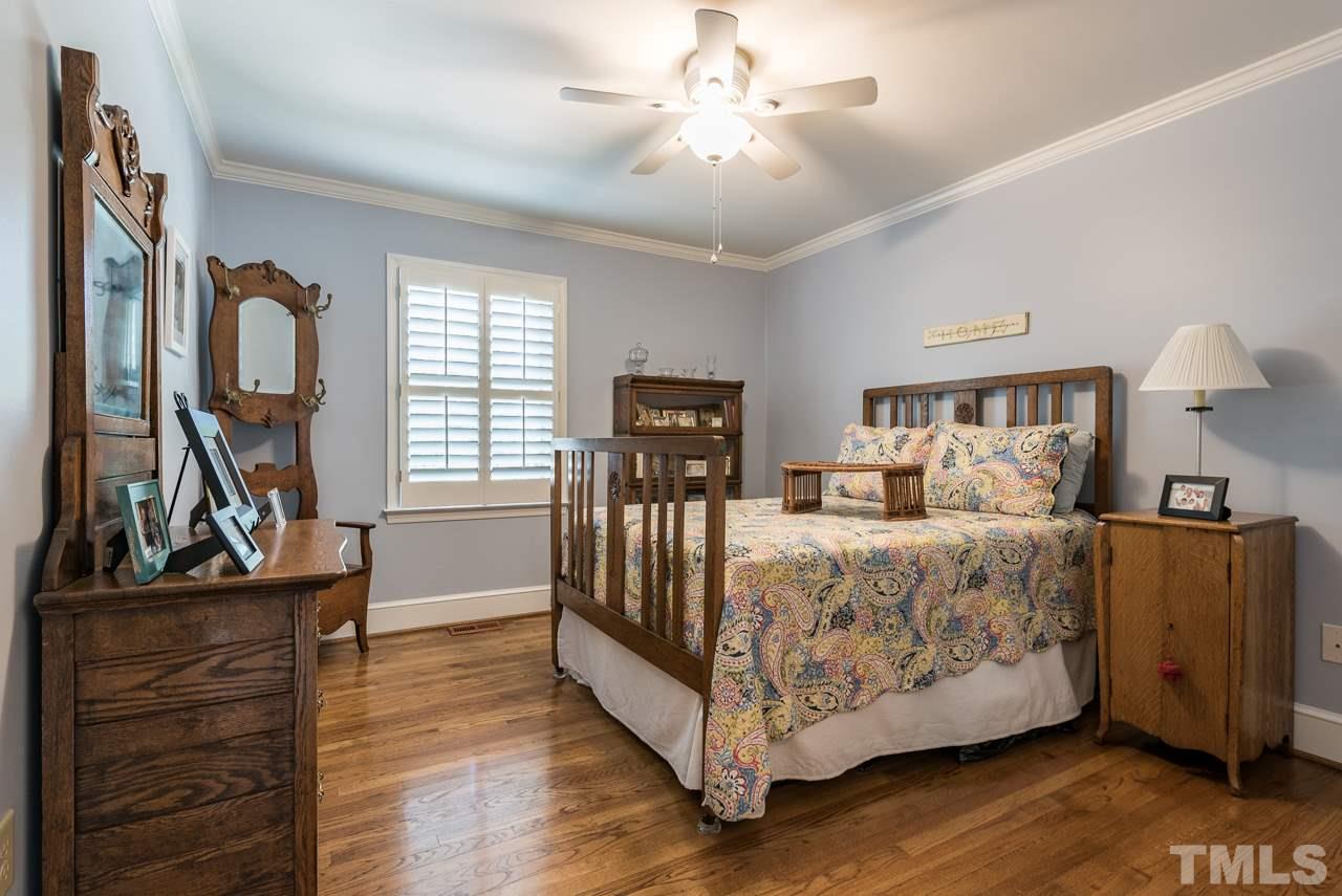2320 Ridge Road Raleigh, NC 27612 - Photo 13 of 25 a bed room with bed and window