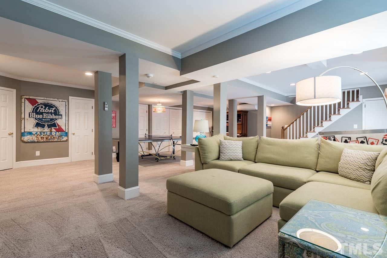 2320 Ridge Road Raleigh, NC 27612 - Photo 21 of 25 a living room with furniture and a view of kitchen