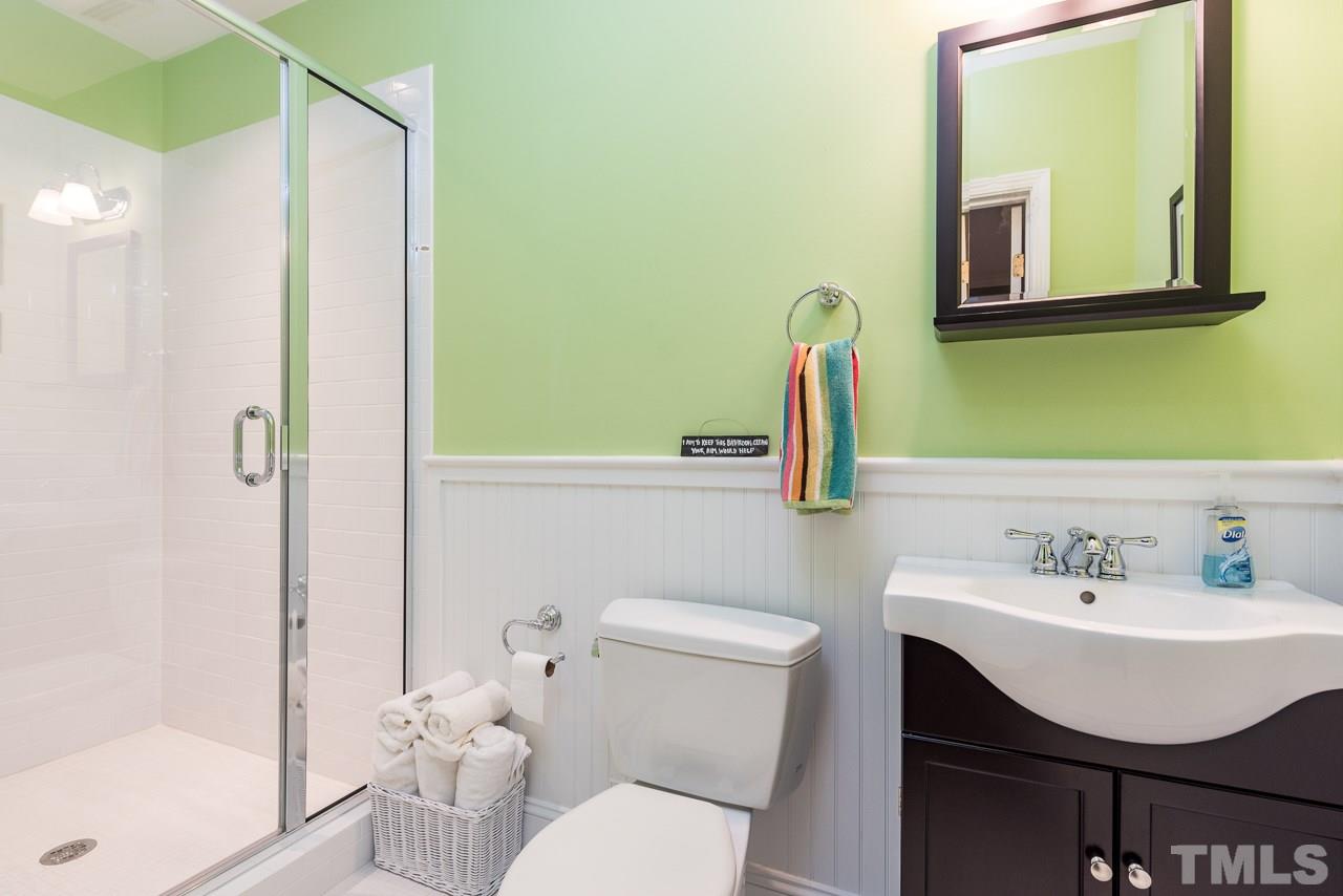 2320 Ridge Road Raleigh, NC 27612 - Photo 22 of 25 a bathroom with a sink mirror and toilet