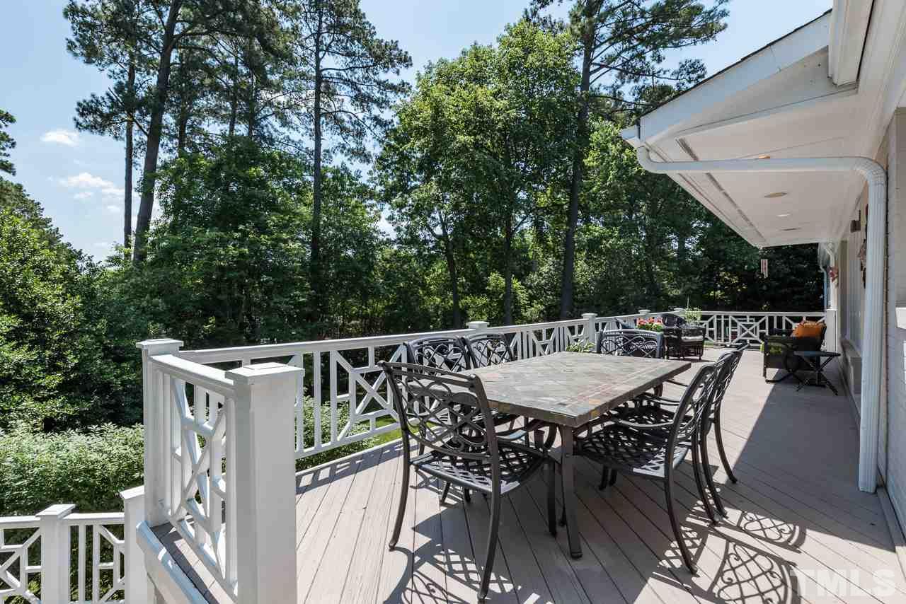 2320 Ridge Road Raleigh, NC 27612 - Photo 24 of 25 a view of a dinning table and chairs in the roof deck