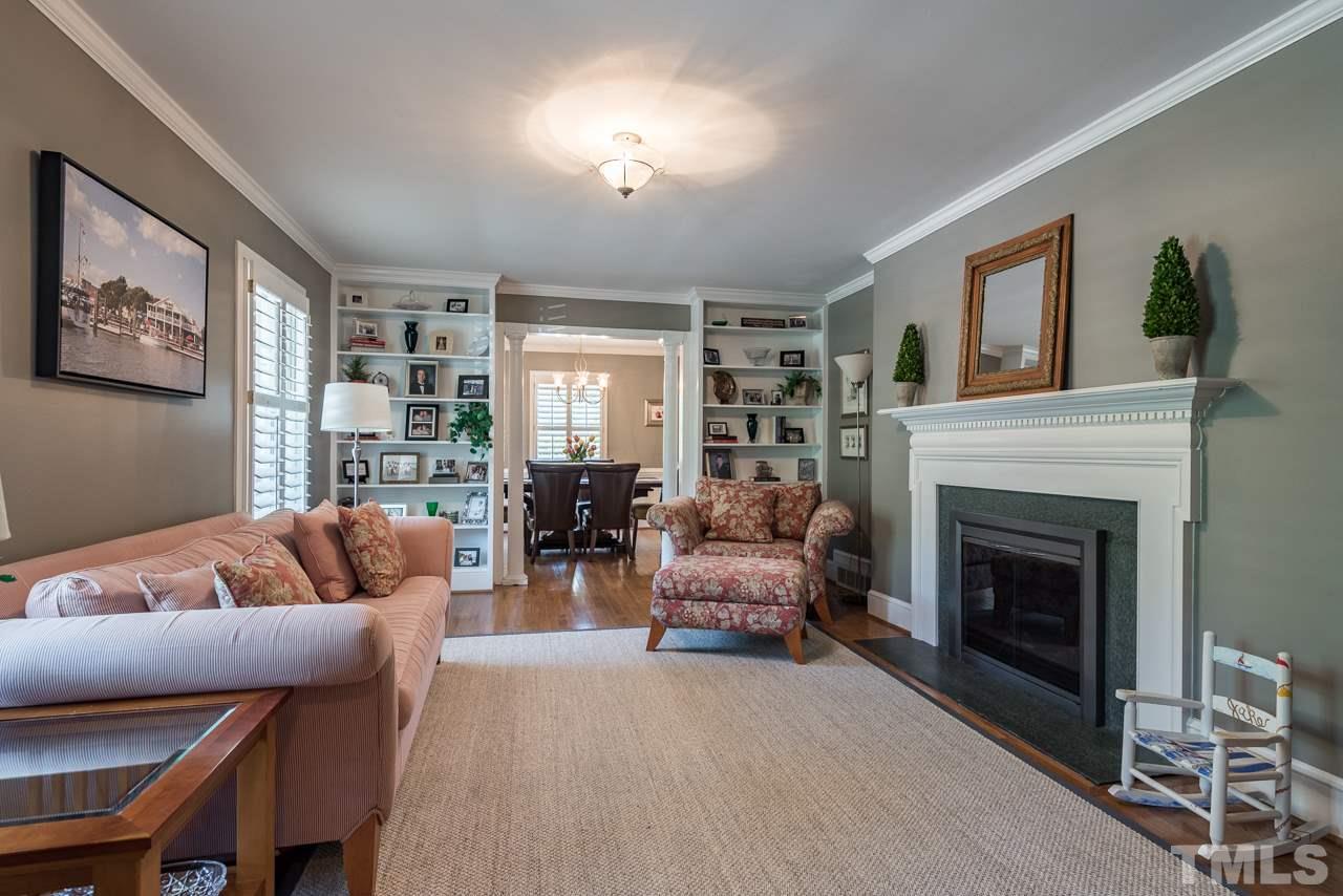 2320 Ridge Road Raleigh, NC 27612 - Photo 4 of 25 a living room with furniture and a fireplace